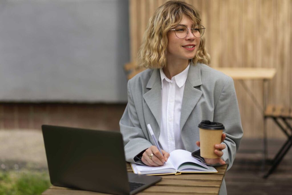 working woman taking notes