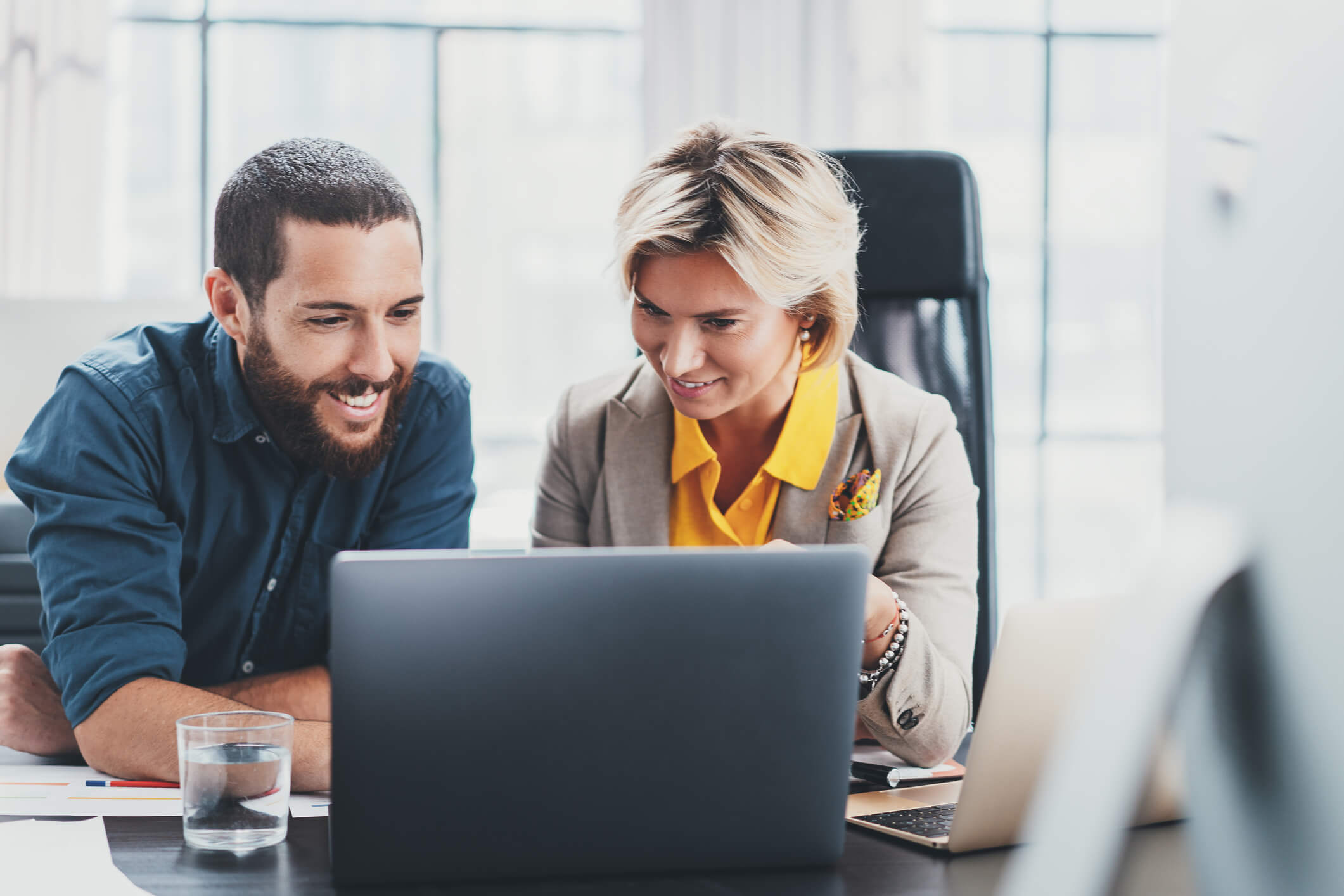 Man and woman at laptop.
